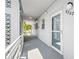 Exterior hallway with decorative breeze blocks leading to resident entrance at 5660 80Th N St # D207, St Petersburg, FL 33709