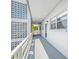 Exterior hallway with decorative breeze blocks leading to resident entrance at 5660 80Th N St # D207, St Petersburg, FL 33709