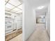 Bright kitchen flowing into the living area with classic white appliances and ample natural light at 5660 80Th N St # D207, St Petersburg, FL 33709