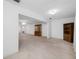 Spacious living room with wood furniture and natural light at 5660 80Th N St # D207, St Petersburg, FL 33709