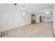 Large living room with neutral carpet, a ceiling fan, and a large china cabinet at 5660 80Th N St # D207, St Petersburg, FL 33709
