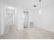 The living room features neutral carpet, fresh paint, and modern lighting at 5660 80Th N St # D207, St Petersburg, FL 33709
