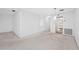 This living room is spacious, has neutral carpet and an entry to the kitchen at 5660 80Th N St # D207, St Petersburg, FL 33709