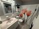 Bathroom featuring a shower/tub combination with a floral shower curtain, sink, and toilet at 5875 18Th N St # 19, St Petersburg, FL 33714
