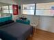 View of the sunlit bedroom showcasing a comfy bed, unique decorations, and serene atmosphere at 5875 18Th N St # 19, St Petersburg, FL 33714
