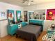 Bright bedroom featuring a comfortable bed, unique blue furniture, and stylish decor at 5875 18Th N St # 19, St Petersburg, FL 33714