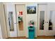 Bedroom closet with mirrored sliding doors, vintage fan, and decor at 5875 18Th N St # 19, St Petersburg, FL 33714