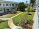 Beautifully landscaped courtyard with lush greenery, walking paths, and well-maintained gardens at 5875 18Th N St # 19, St Petersburg, FL 33714