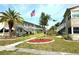 Well-maintained condo community featuring mature landscaping and an American flag at 5875 18Th N St # 19, St Petersburg, FL 33714