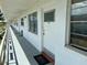 Hallway with a unit door, windows, and an outdoor walkway overlooking the community at 5875 18Th N St # 19, St Petersburg, FL 33714