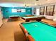 Spacious game room with multiple pool tables, cue racks, and ample lighting at 5875 18Th N St # 19, St Petersburg, FL 33714