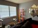 Cozy living room area with large windows, a bookshelf, and comfortable seating at 5875 18Th N St # 19, St Petersburg, FL 33714