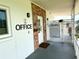 Welcoming office entrance with signage, pool rules, and secure gate access at 5875 18Th N St # 19, St Petersburg, FL 33714