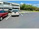 Exterior of building with an asphalt parking lot featuring parking spaces and parked vehicles at 5875 18Th N St # 19, St Petersburg, FL 33714
