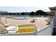 Community pool area with lounge chairs and tables, perfect for relaxation and outdoor enjoyment at 5875 18Th N St # 19, St Petersburg, FL 33714