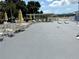 Pool deck with ample seating, umbrellas, and space for activities at 5875 18Th N St # 19, St Petersburg, FL 33714