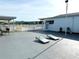 A recreational area featuring cornhole, a walkway, and a building in the background at 5875 18Th N St # 19, St Petersburg, FL 33714