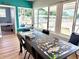 Community room with table, puzzle and windows, offering a great space for residents to enjoy their time at 5875 18Th N St # 19, St Petersburg, FL 33714