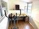 Bright sunroom with large windows, hardwood floors, and exercise equipment at 5875 18Th N St # 19, St Petersburg, FL 33714