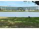 Scenic view of building and pond with fountain, showcasing the community's serene outdoor space at 5875 18Th N St # 19, St Petersburg, FL 33714