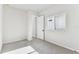 Neutral-toned bedroom with carpet and a door and window in this new home at 5979 Hidden Branch Dr, Apollo Beach, FL 33572