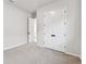 Bright bedroom with carpet and double doors for ample closet space in this home at 5979 Hidden Branch Dr, Apollo Beach, FL 33572