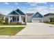 Beautifully designed home featuring a spacious driveway and well-maintained lawn at 5979 Hidden Branch Dr, Apollo Beach, FL 33572