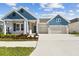 Charming single-Gathering home boasting a two-car garage and beautifully landscaped front yard at 5979 Hidden Branch Dr, Apollo Beach, FL 33572