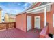 Charming backyard deck attached to the peach home at 6414 N Central Ave, Tampa, FL 33604