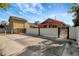The concrete backyard with a fence ensures privacy and space for outdoor activities at 6414 N Central Ave, Tampa, FL 33604