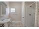 Bathroom with a shower, sink, toilet, and a small window at 6414 N Central Ave, Tampa, FL 33604