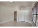 Spacious bedroom features neutral colors, a ceiling fan, and tile flooring at 6414 N Central Ave, Tampa, FL 33604