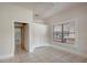 Well-lit bedroom with tiled floors, closet, and window at 6414 N Central Ave, Tampa, FL 33604