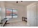 Bright bedroom with a window, ceiling fan, tile flooring, and closet at 6414 N Central Ave, Tampa, FL 33604
