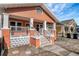 Inviting home exterior featuring a cozy porch and attractive landscaping at 6414 N Central Ave, Tampa, FL 33604