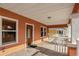 Inviting front porch with a wooden door, stucco walls, and a concrete floor at 6414 N Central Ave, Tampa, FL 33604