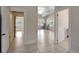Living room with tile floors and a view into another room at 6414 N Central Ave, Tampa, FL 33604