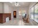 Living room with a fireplace, tile floors, and two rocking chairs at 6414 N Central Ave, Tampa, FL 33604