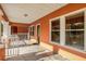 Inviting porch features stucco walls, concrete flooring, and windows at 6414 N Central Ave, Tampa, FL 33604