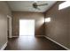 Bright bedroom with wood floors and lots of light from the sliding glass doors at 6618 Pineview Ter # 6618, Bradenton, FL 34203