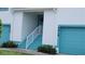 Close up view of the entrance to condos with a staircase and attached garage at 6618 Pineview Ter # 6618, Bradenton, FL 34203