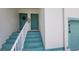 Close up view of the entrance to condos with a staircase and attached garage at 6618 Pineview Ter # 6618, Bradenton, FL 34203