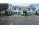 Charming townhome featuring colorful garage doors, well-kept landscaping, and a welcoming entrance at 6618 Pineview Ter # 6618, Bradenton, FL 34203