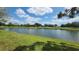 Scenic view of a beautiful golf course and pond on a sunny day at 6618 Pineview Ter # 6618, Bradenton, FL 34203