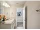 Bathroom featuring marble countertop vanity with modern fixtures, tile flooring and neutral walls at 10815 Windswept Garden Way, Tampa, FL 33647