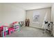 Bright bedroom with plush carpet, window view and space for toys at 10815 Windswept Garden Way, Tampa, FL 33647