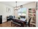 Cozy dining space with a piano, decorative lighting, and a bookcase for books and decorations at 10815 Windswept Garden Way, Tampa, FL 33647