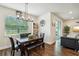 Bright dining area with stylish light fixture, contemporary decor, and a slider to the backyard at 10815 Windswept Garden Way, Tampa, FL 33647
