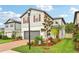 This home features a lush lawn and well-maintained landscaping, enhancing its curb appeal at 10815 Windswept Garden Way, Tampa, FL 33647