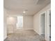 Spacious upstairs hallway with carpeting and multiple doorways to rooms at 10815 Windswept Garden Way, Tampa, FL 33647